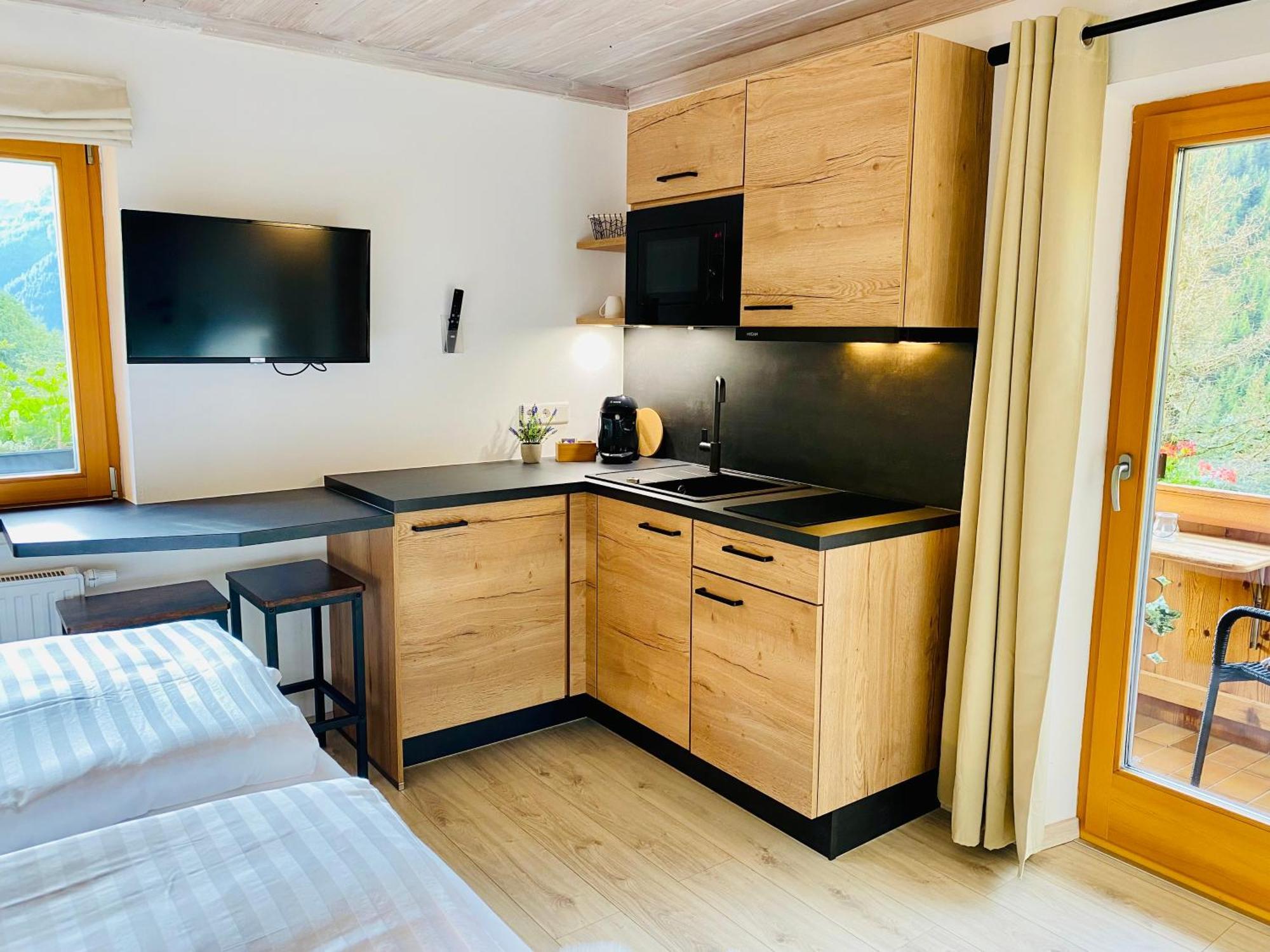 Alm Seasons Premium Chalet & Studios Зальбах-Хинтерглемм Номер фото